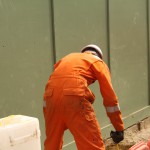 Electical Engineer Lad Wearing Portwest Bizflame Orange Boilersuit 23 Engineer lad replacing street paving that was removed to install a new electricity supply