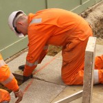 Electical Engineer Lad Wearing Portwest Bizflame Orange Boilersuit 28 Engineer lad replacing street paving that was removed to install a new electricity supply