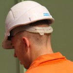 Electical Engineer Lad Wearing Portwest Bizflame Orange Boilersuit 3 Engineer lad replacing street paving that was removed to install a new electricity supply