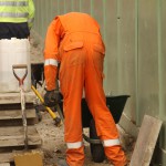 Electical Engineer Lad Wearing Portwest Bizflame Orange Boilersuit 7 Engineer lad replacing street paving that was removed to install a new electricity supply