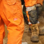Electical Engineer Lad Wearing Portwest Bizflame Orange Boilersuit 8 Engineer lad replacing street paving that was removed to install a new electricity supply