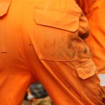 Electical Engineer Lad Wearing Portwest Bizflame Orange Boilersuit 9 Engineer lad replacing street paving that was removed to install a new electricity supply